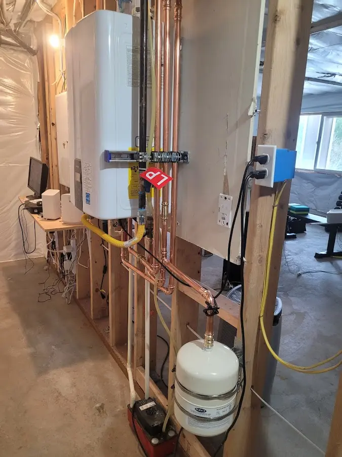Licensed plumber repairing a kitchen sink in Mount Vernon
